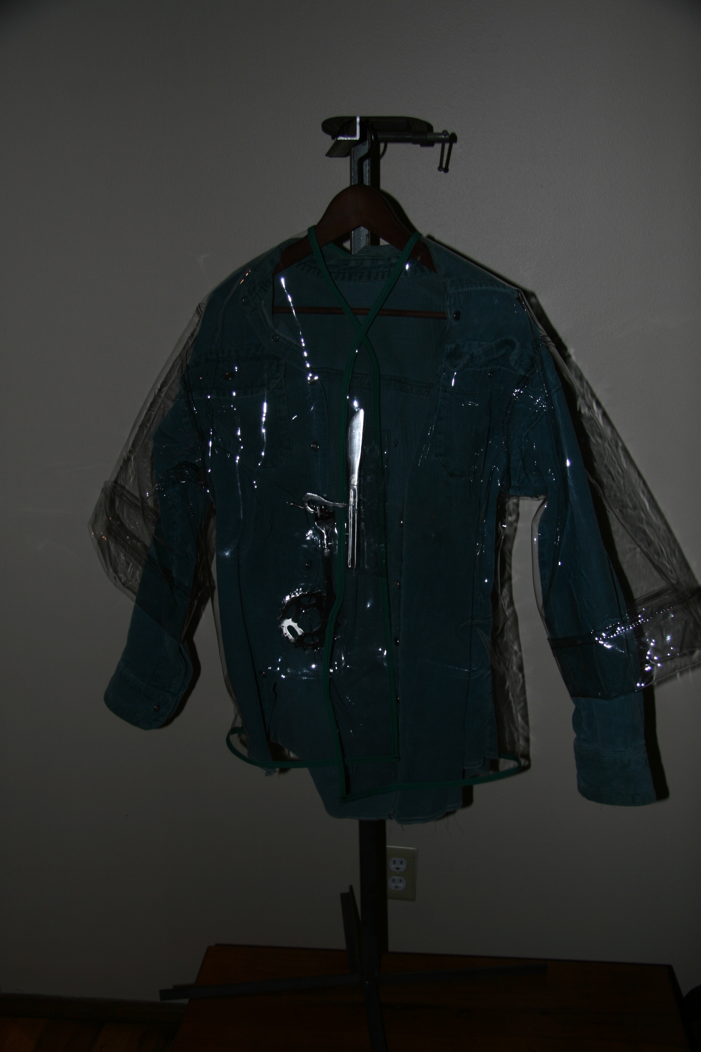Childs Clear Plastic Raincoat With Hand Crafted Steel Sculpture For Closure